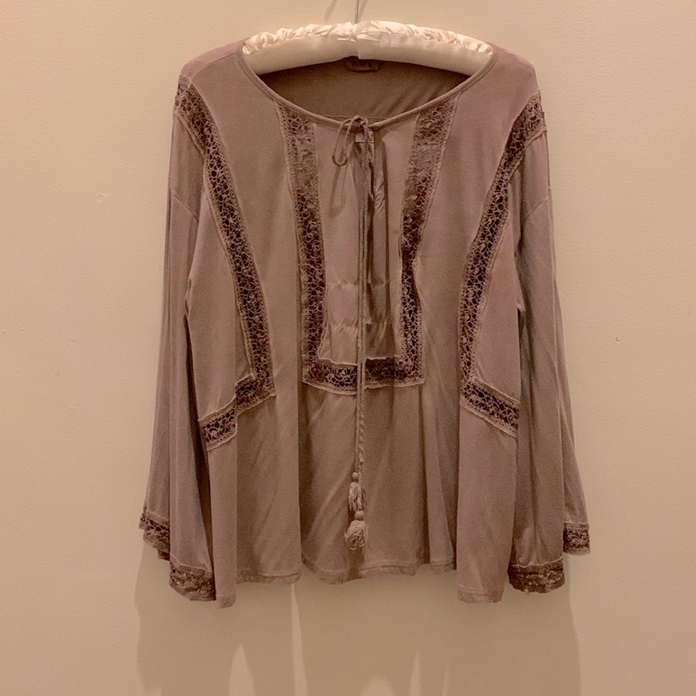 Boho style taupe top with bell sleeves and front tie with tassels